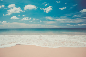 Fototapeta na wymiar Blur tropical beach with bokeh sun light wave abstract background. Travel concept.