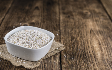 Wooden table with a portion of puffed Amaranth (selective focus)