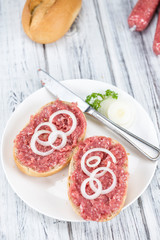 Mett on a bun (German cuisine; selective focus)