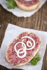 Bun with Mett (German cuisine; selective focus)