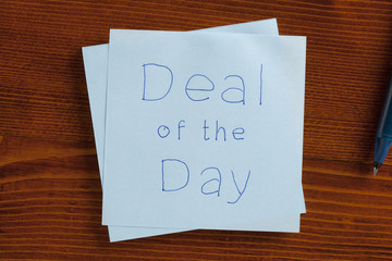 Deal of the Day handwritten on a note