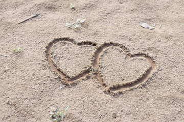 two hearts and sand