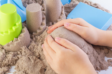 Fun kinetic sand.Child building sand castle - 111213014