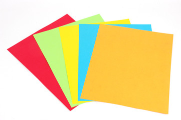 stacking colored papers isolated in white background