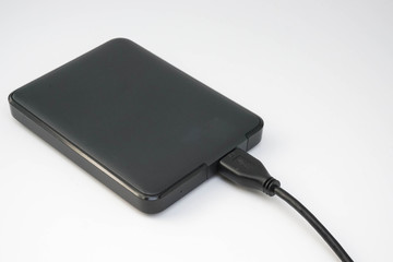 black external hard disk in white background