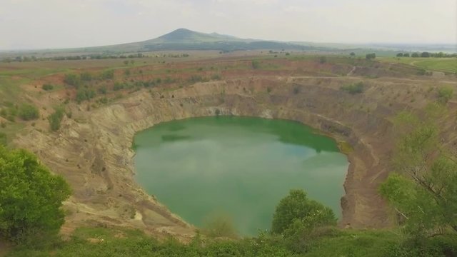 Abandoned open mine pit near Tsar Asen village in Bulgaria