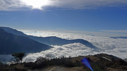 Fototapeta na wymiar Clouds and Mountains viewed along the road from Dirang to Tawang valley over the Se La Pass, Arunachal Pradesh, India