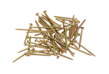 Pile of chipboard screws on a light background