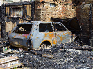 Fototapeta premium Burned garage and car