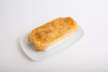 Bowl of soup with baked bread over it