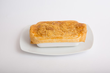 Bowl of soup with baked bread over it