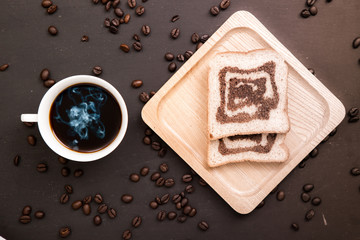 coffee and bread on wooden