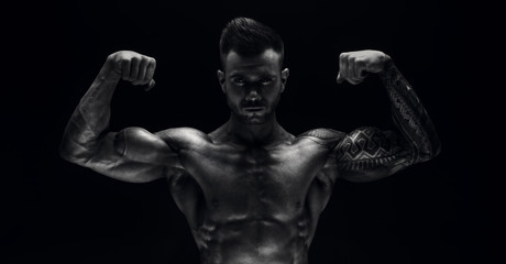 Fototapeta na wymiar Men's physique. Champion. Bodybuilder.