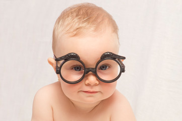 baby girl with funny glasses