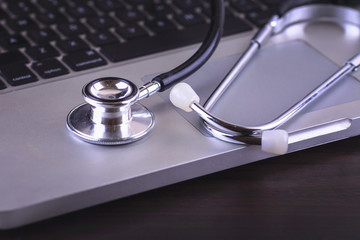 stethoscope on the keyboard of pc.