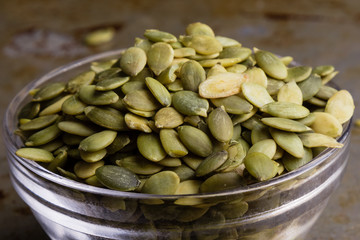 pumpkin seeds in a glass bowl