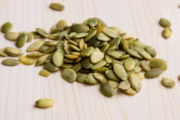 pumpkin seeds on wooden table