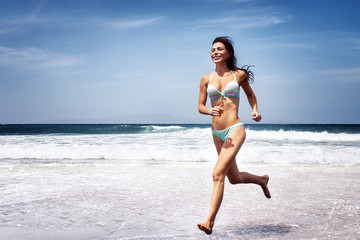 Woman running on a beach