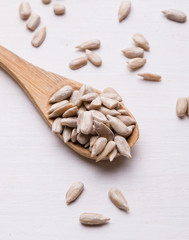 sunflower seeds on wooden spoon