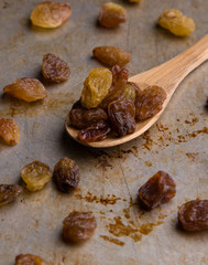 raisins on wooden spoon