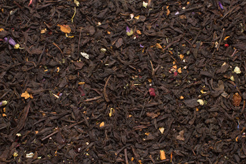 mountain black tea leaves with flowers and fruits texture