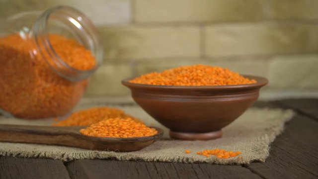 Red Lentils In A Ceramic Bowl On Old Wooden Table ( Dolly Shot )