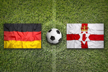 Germany vs. Northern Ireland flags on soccer field