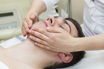 Fototapeta na wymiar process of massage and facials in beauty salon