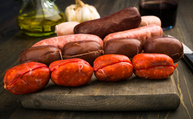 Spanish raw sausages on rustic wooden