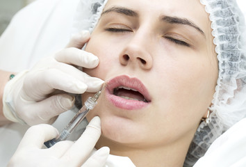young girl in a clinic contour lips procedure