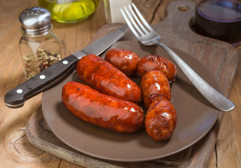 several Iberian sausages grilled in  dish