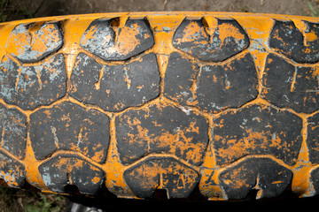 Old truck tire texture. Grunge stile background.
