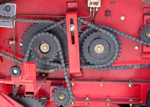 Gears and chains on red background