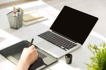 Fototapeta premium Man using graphic tablet