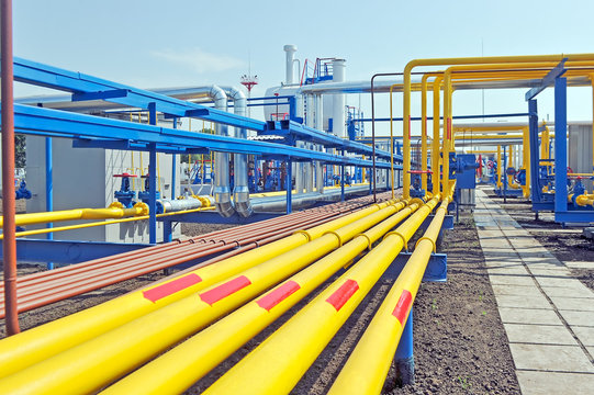 Yellow Gas Pipes In Natural Gas Treatment Plant In Bright Sunny Summer Day