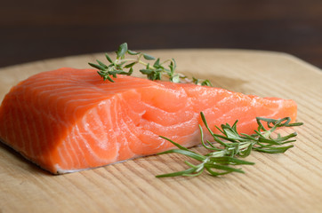 Raw salmon on cutting board