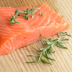 Raw salmon on cutting board