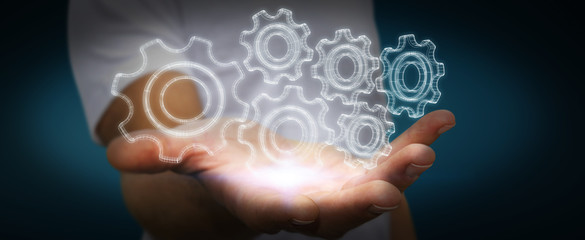 Businessman holding digital 3D engine