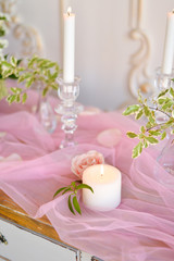 wedding candles and flowers on table 