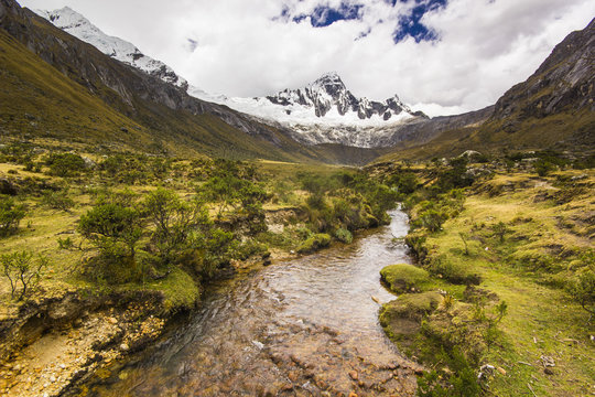 panorama of snow-covered Andes mountains and river