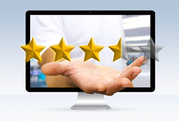 Young businessman ranking with his hand using digital star