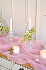Obraz na płótnie Canvas wedding candles and flowers on table 