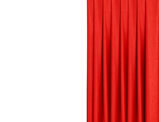 Red curtain on theater or cinema stage slightly open