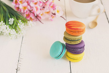 Colorful macaroons and a cup of coffee
