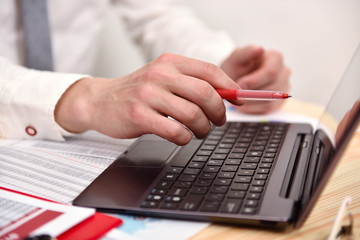 Fototapeta premium Businessman hand pointing to screen laptop