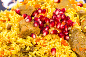 Fragrant pilaf with meat and dried apricots.