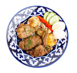 Delicious baked meat mix with garnish.