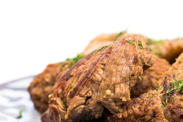 Delicious baked meat mix with garnish.