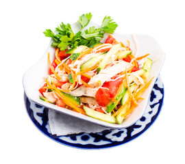 Chinese chicken salad with cucumber and tomatoes.