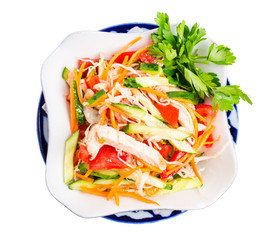 Chinese chicken salad with cucumber and tomatoes.
